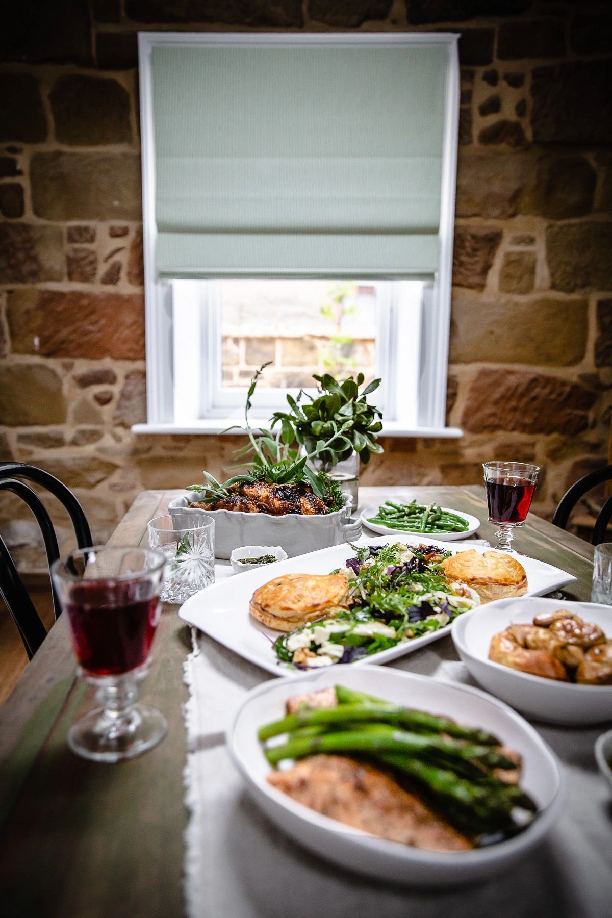 Banquet dining table with multiple dishes at Raffah House